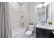 Clean bathroom with a tub, toilet, and vanity at 5255 Cicerone St, Sarasota, FL 34238