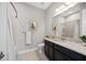 Modern bathroom with dark vanity and granite countertop at 5255 Cicerone St, Sarasota, FL 34238