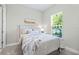 Bright bedroom with a queen bed, dresser, and window at 5255 Cicerone St, Sarasota, FL 34238