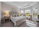 Main bedroom with light wood furniture and window seating at 5255 Cicerone St, Sarasota, FL 34238