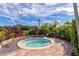 Relaxing hot tub surrounded by lush landscaping at 5255 Cicerone St, Sarasota, FL 34238