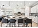 Modern kitchen with white cabinets, granite counters and island seating at 5255 Cicerone St, Sarasota, FL 34238