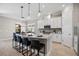 Modern kitchen with white cabinets, granite counters, and stainless steel appliances at 5255 Cicerone St, Sarasota, FL 34238