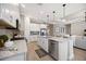 Modern kitchen with white cabinets, granite counters and stainless steel appliances at 5255 Cicerone St, Sarasota, FL 34238