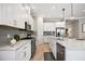 Modern kitchen with white cabinets, granite countertops, and stainless steel appliances at 5255 Cicerone St, Sarasota, FL 34238