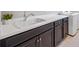 Laundry room with dark cabinets and white countertop at 5255 Cicerone St, Sarasota, FL 34238