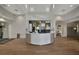 Modern community clubhouse lobby with a curved reception desk at 5255 Cicerone St, Sarasota, FL 34238