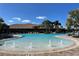 Relaxing resort-style pool with palm trees and lounge chairs at 5255 Cicerone St, Sarasota, FL 34238