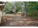 Large backyard with mature trees and playset at 5504 Birchwood Rd, Spring Hill, FL 34608