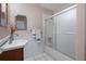 Updated bathroom with vanity, shower/tub combo and tiled flooring at 5504 Birchwood Rd, Spring Hill, FL 34608