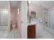 Updated bathroom with tub and shower, toilet and vanity at 5504 Birchwood Rd, Spring Hill, FL 34608