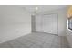 Spacious bedroom with tile floors and built-in closet at 5504 Birchwood Rd, Spring Hill, FL 34608