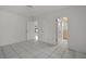 Bright bedroom with tile floor and access to bathroom at 5504 Birchwood Rd, Spring Hill, FL 34608