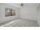 Spacious bedroom with tile flooring and ample closet space at 5504 Birchwood Rd, Spring Hill, FL 34608