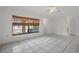 Living room with tile floors and view to another room at 5504 Birchwood Rd, Spring Hill, FL 34608