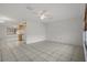 Bright living room with tile floors and neutral walls at 5504 Birchwood Rd, Spring Hill, FL 34608