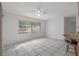 Bright living room with tile flooring and large window at 5504 Birchwood Rd, Spring Hill, FL 34608