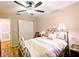 Bedroom with double bed, dresser, and access to hallway at 5918 Palm Ln # C33, Bradenton, FL 34207