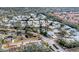 Aerial view of community with home circled, showcasing landscaping and pond at 6009 Bonaventure Pl, Sarasota, FL 34243