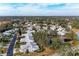 Aerial view of a large community with numerous homes and a pond at 6009 Bonaventure Pl, Sarasota, FL 34243