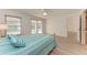 Bedroom with a queen-size bed and sliding door to patio at 6009 Bonaventure Pl, Sarasota, FL 34243