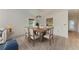 Dining room with a wooden table, chairs, and area rug at 6009 Bonaventure Pl, Sarasota, FL 34243