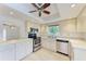 Kitchen with stainless steel appliances and light wood cabinets at 6009 Bonaventure Pl, Sarasota, FL 34243