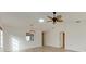 Bright living room featuring hardwood floors and high ceilings at 6009 Bonaventure Pl, Sarasota, FL 34243