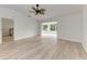 Bright living room featuring light flooring and access to sunroom at 6009 Bonaventure Pl, Sarasota, FL 34243