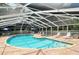 Community pool and spa with covered seating area at 6009 Bonaventure Pl, Sarasota, FL 34243