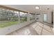 Sunroom featuring light flooring and large windows at 6009 Bonaventure Pl, Sarasota, FL 34243