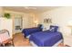 Guest bedroom with twin beds and access to patio at 6200 Flotilla Dr # 241, Holmes Beach, FL 34217