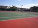 Community tennis court with red and green surface at 6200 Flotilla Dr # 241, Holmes Beach, FL 34217