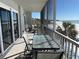 Private balcony with ocean view and seating at 6312 Midnight Pass Rd # 301S, Sarasota, FL 34242