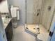 Bathroom with shower and granite vanity at 6312 Midnight Pass Rd # 301S, Sarasota, FL 34242