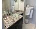 Bathroom with granite vanity and glass sink at 6312 Midnight Pass Rd # 301S, Sarasota, FL 34242