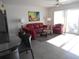 Bright living room with red couches and ocean view at 6312 Midnight Pass Rd # 301S, Sarasota, FL 34242