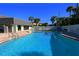 Community pool with lounge chairs at 6312 Midnight Pass Rd # 301S, Sarasota, FL 34242