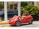 Red three-wheeled car for rent at 6312 Midnight Pass Rd # 301S, Sarasota, FL 34242