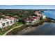 Aerial view of waterfront community featuring luxurious condos with red tile roofs at 6442 Mourning Dove Dr # 6442, Bradenton, FL 34210