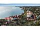 Aerial view of waterfront villas with red roofs surrounded by beautiful blue water at 6442 Mourning Dove Dr # 6442, Bradenton, FL 34210