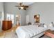 Bright bedroom with a queen bed and wood floors at 6442 Mourning Dove Dr # 6442, Bradenton, FL 34210