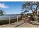 Deck overlooking the water with seating for relaxation at 6442 Mourning Dove Dr # 6442, Bradenton, FL 34210