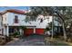 Beautiful white-painted villa exterior with a red roof and attached two-car garages at 6442 Mourning Dove Dr # 6442, Bradenton, FL 34210