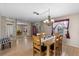 Bright dining room with wood floors and a chandelier at 6824 Jarvis Rd, Sarasota, FL 34241