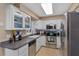 Modern kitchen with stainless steel appliances and white cabinets at 6824 Jarvis Rd, Sarasota, FL 34241