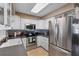 Modern kitchen with stainless steel appliances and white cabinets at 6824 Jarvis Rd, Sarasota, FL 34241