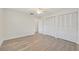 Spacious bedroom with grey vinyl flooring and white closet doors at 7157 Fairway Bend Cir, Sarasota, FL 34243