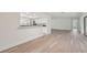 Light and airy dining area with wood-look flooring flows into the kitchen at 7157 Fairway Bend Cir, Sarasota, FL 34243