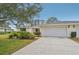 Updated single-story home with a two-car garage and landscaped yard at 7157 Fairway Bend Cir, Sarasota, FL 34243